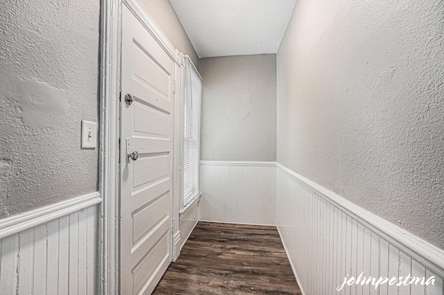 1108/1110 Muskegon Ave NW, Grand Rapids, MI 49504 - hallway with wainscoting, a textured wall, and wood finished floors