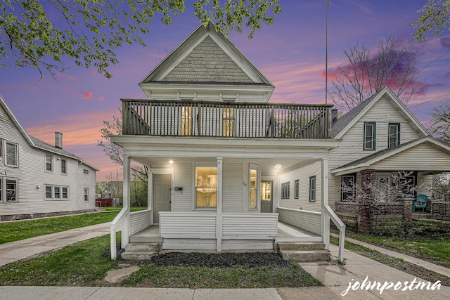1108/1110 Muskegon Ave NW, Grand Rapids, MI 49504 - victorian-style house featuring a balcony and covered porch