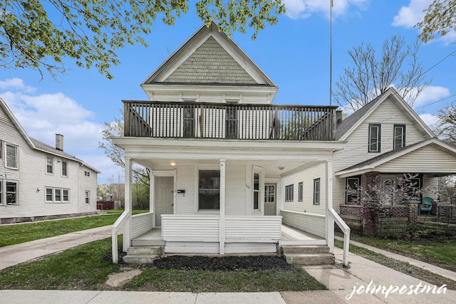 1108/1110 Muskegon Ave NW, Grand Rapids, MI 49504 - view of front of property featuring a porch and a balcony