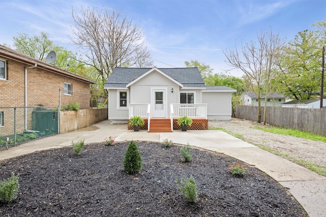 91 S Josephine Ave, Waterford, MI 48328 - bungalow-style home with a fenced backyard, a patio, and roof with shingles
