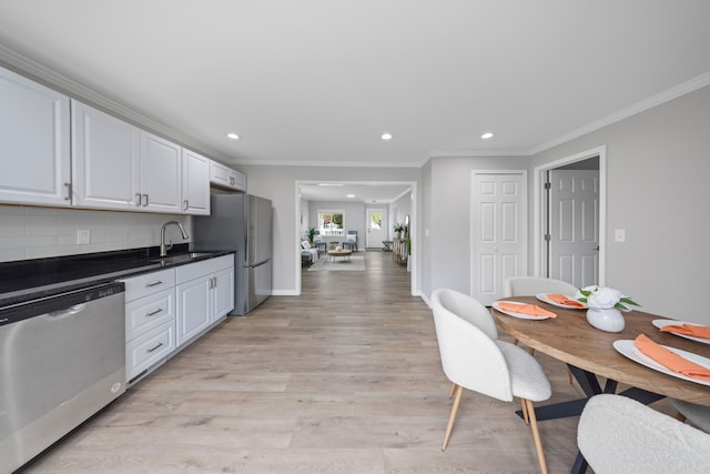 91 S Josephine Ave, Waterford, MI 48328 - kitchen with stainless steel appliances, a sink, recessed lighting, white cabinetry, and tasteful backsplash