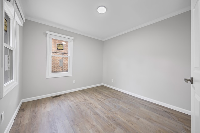 91 S Josephine Ave, Waterford, MI 48328 - spare room featuring ornamental molding, wood finished floors, and baseboards