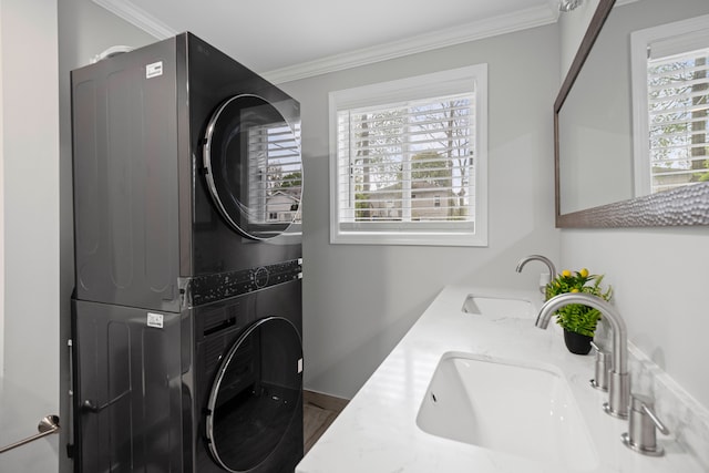 91 S Josephine Ave, Waterford, MI 48328 - laundry area featuring stacked washer / drying machine, plenty of natural light, and crown molding