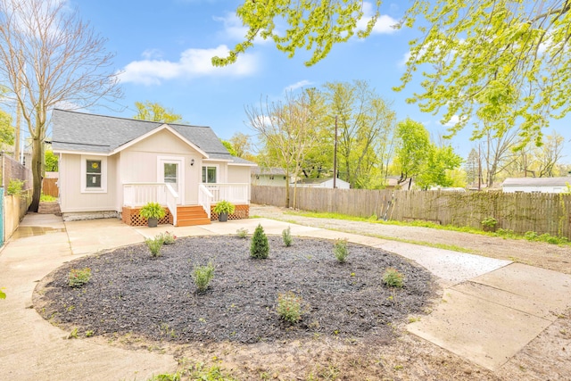 91 S Josephine Ave, Waterford, MI 48328 - view of front facade featuring a fenced backyard, a shingled roof, and a patio