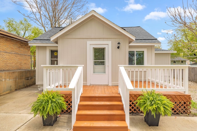 91 S Josephine Ave, Waterford, MI 48328 - entrance to property with a shingled roof, fence, and a deck