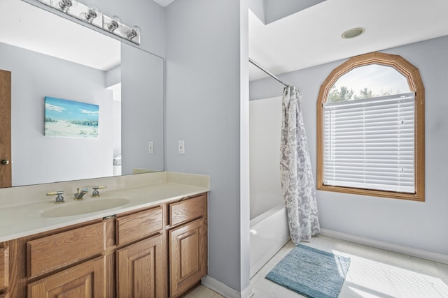 6480 Scenic Pines Ct, Clarkston, MI 48346 - full bath with shower / bath combo with shower curtain, vanity, tile patterned flooring, and baseboards