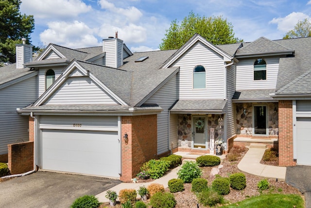 6480 Scenic Pines Ct, Clarkston, MI 48346 - view of front of home with a chimney, roof with shingles, a garage, and driveway