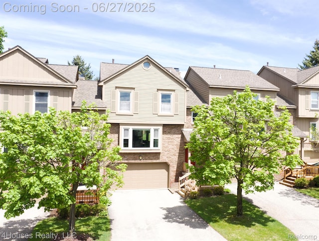 4184 Colorado Ln Unit 117, West Bloomfield, MI 48322 - view of property with an attached garage and asphalt driveway
