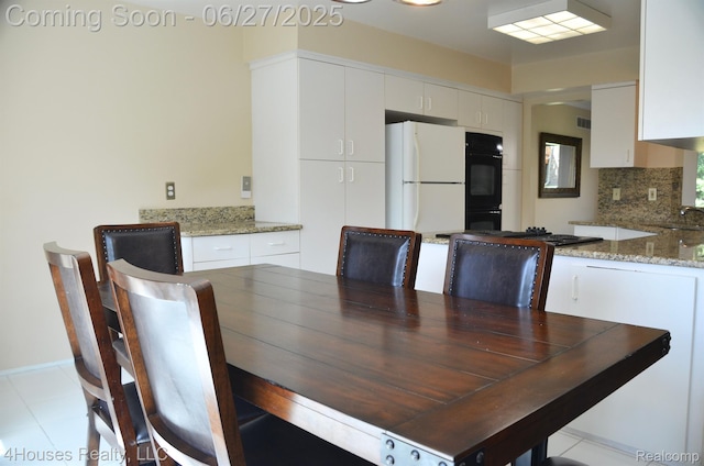 4184 Colorado Ln Unit 117, West Bloomfield, MI 48322 - dining room featuring baseboards