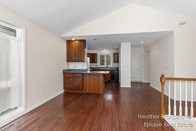 kitchen featuring lofted ceiling, black dishwasher, dark wood finished floors, visible vents, and a peninsula