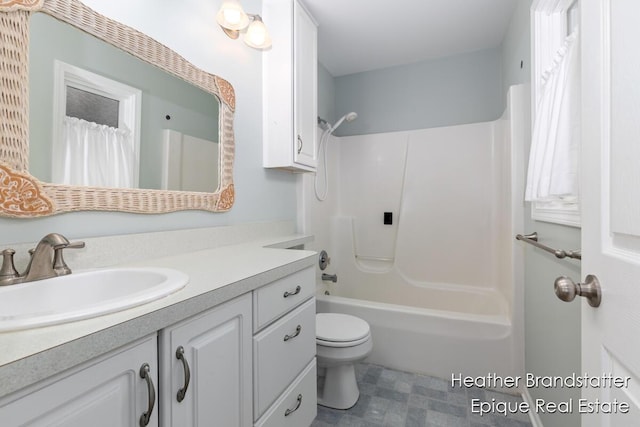 bathroom with toilet, shower / tub combo with curtain, tile patterned floors, and vanity