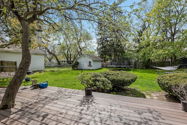 6171 S Main St, Clarkston, MI 48346 - view of patio with a trampoline, an outdoor structure, a deck, and a storage shed