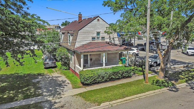 view of property exterior featuring a chimney