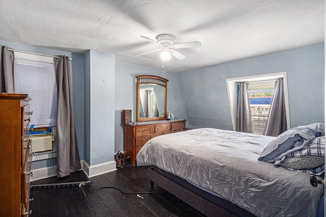 bedroom featuring baseboards, dark wood-type flooring, and ceiling fan