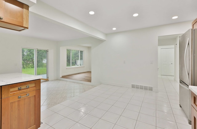 spare room featuring light tile patterned floors and recessed lighting