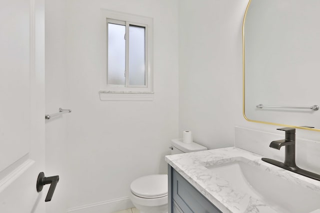 bathroom with toilet and vanity
