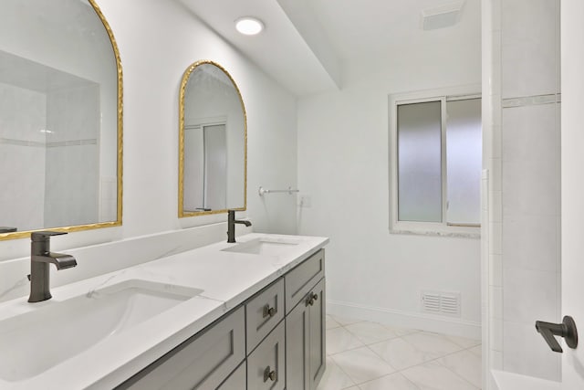 bathroom with double vanity, recessed lighting, and tile patterned flooring
