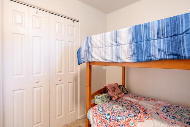 bedroom with a closet and carpet