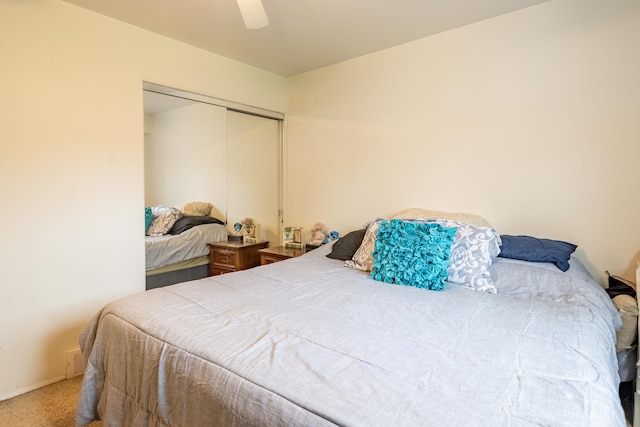 bedroom with a closet, carpet, and ceiling fan