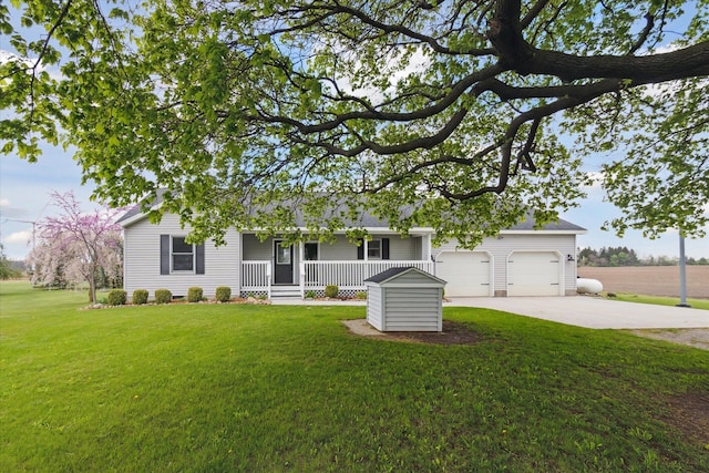 ranch-style house with covered porch, concrete driveway, a garage, and a front lawn