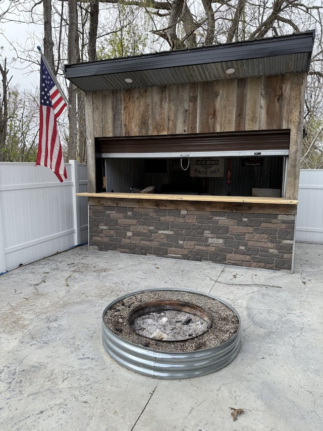 4212 4th St, Brown City, MI 48416 - exterior details with a fire pit and fence