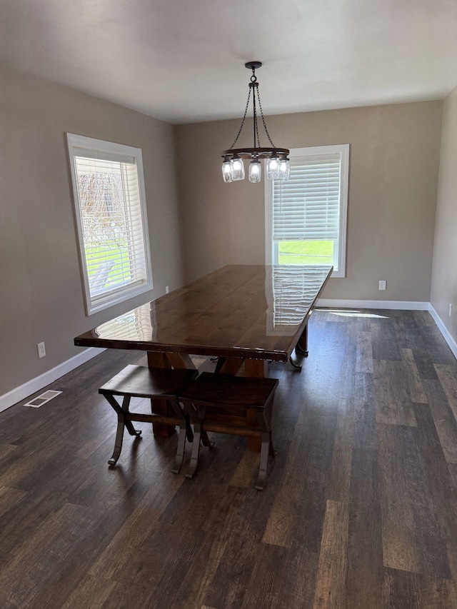 4212 4th St, Brown City, MI 48416 - dining space with visible vents, baseboards, and dark wood-type flooring