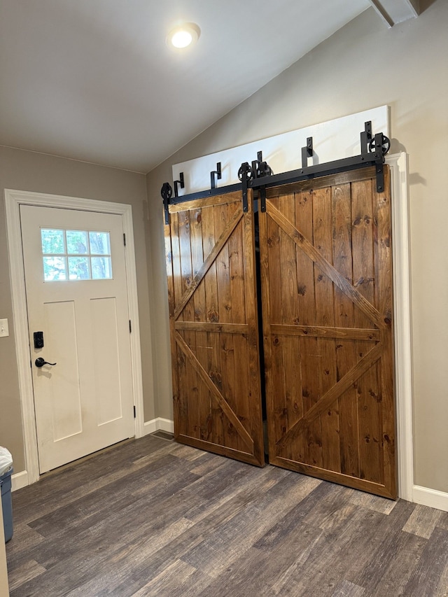 4212 4th St, Brown City, MI 48416 - interior space with lofted ceiling, a barn door, baseboards, and wood finished floors