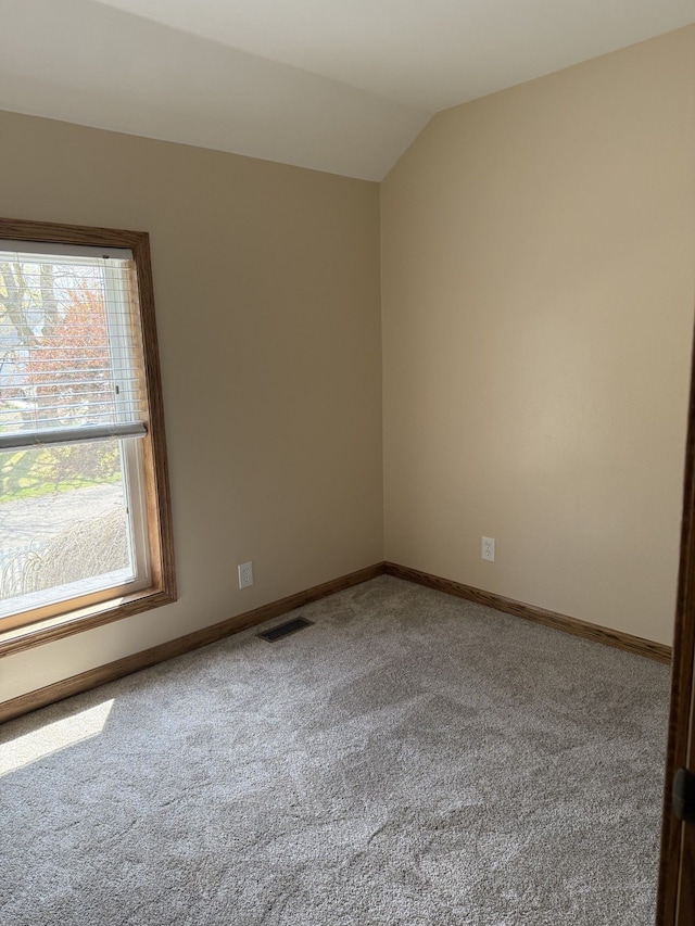 4212 4th St, Brown City, MI 48416 - carpeted spare room featuring visible vents, baseboards, and lofted ceiling