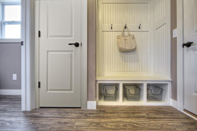 mudroom with baseboards and wood finished floors