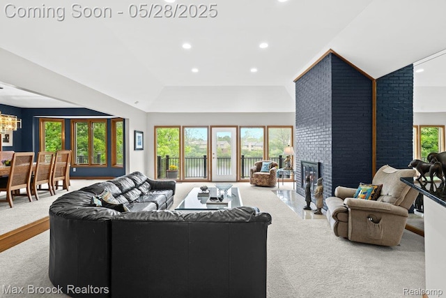 4395 Hickory Ct, Orchard Lake, MI 48323 - carpeted living room with a fireplace, recessed lighting, a chandelier, and lofted ceiling