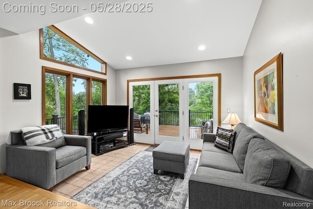 4395 Hickory Ct, Orchard Lake, MI 48323 - living room with plenty of natural light, french doors, recessed lighting, and high vaulted ceiling