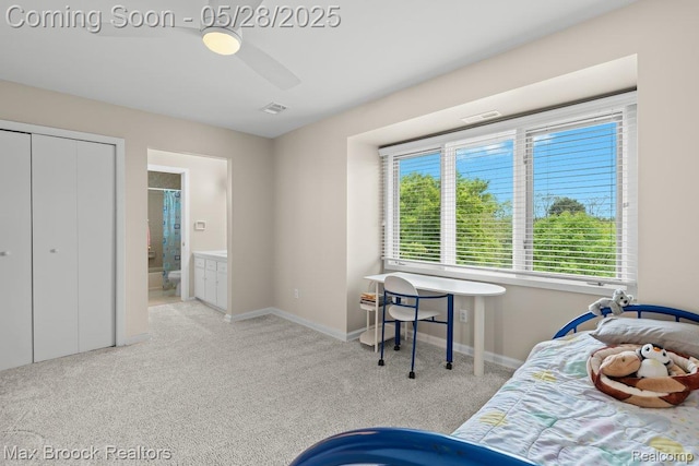 4395 Hickory Ct, Orchard Lake, MI 48323 - carpeted bedroom with ensuite bathroom, ceiling fan, and baseboards