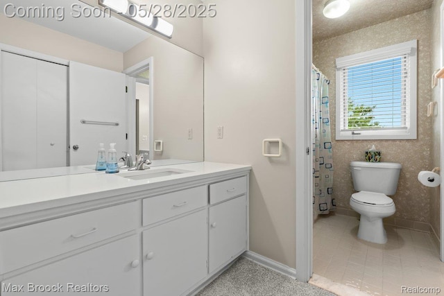 4395 Hickory Ct, Orchard Lake, MI 48323 - full bathroom with vanity, toilet, baseboards, and tile patterned flooring