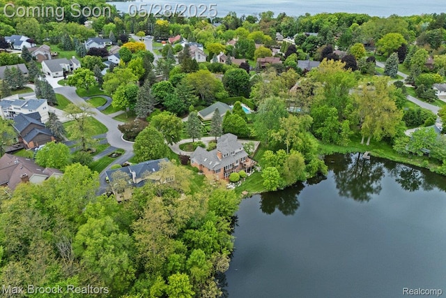 4395 Hickory Ct, Orchard Lake, MI 48323 - aerial view of property and surrounding area featuring a large body of water, nearby suburban area, and a tree filled landscape