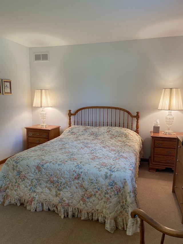 bedroom featuring light colored carpet