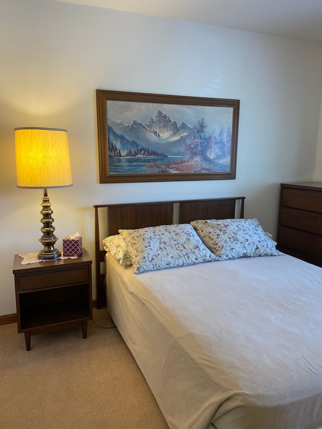 carpeted bedroom with baseboards
