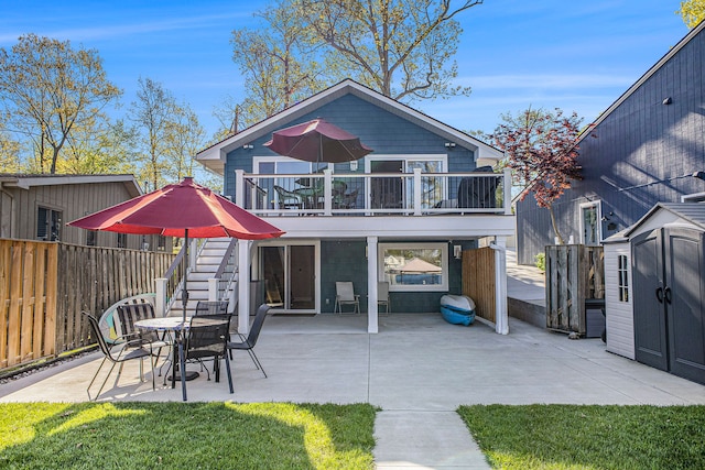16232 Cove Dr, Linden, MI 48451 - back of property featuring a storage shed, a patio, an outdoor structure, fence, and stairway