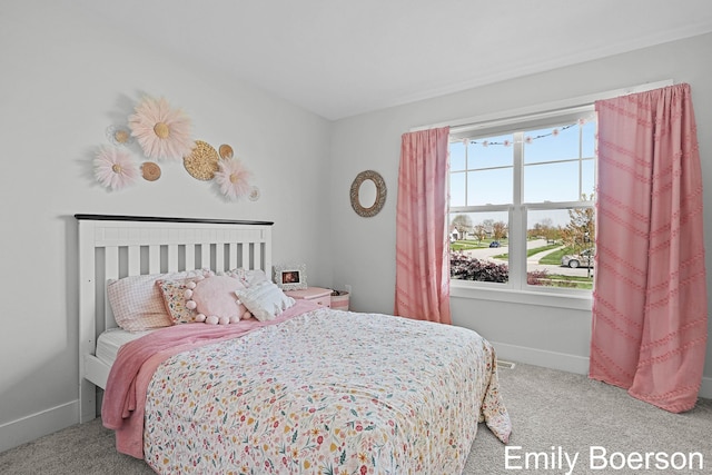 bedroom with carpet and baseboards