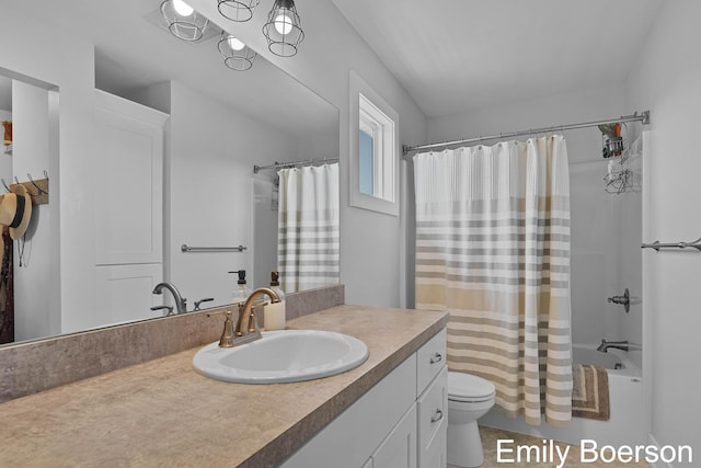 bathroom featuring vanity, toilet, and shower / bathtub combination with curtain
