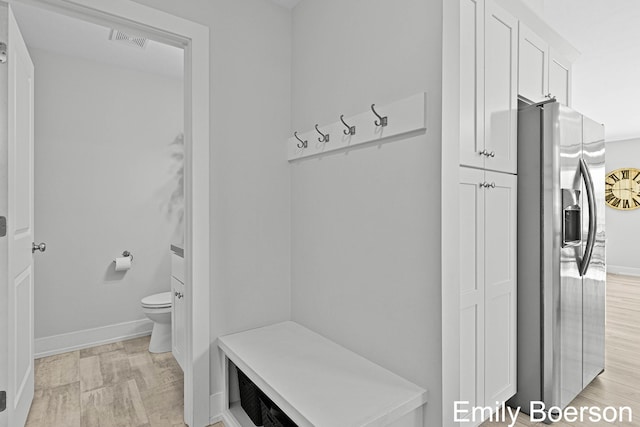 mudroom with baseboards and visible vents
