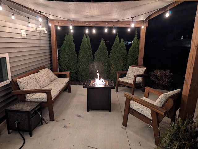 patio at twilight with an outdoor living space with a fire pit and a pergola