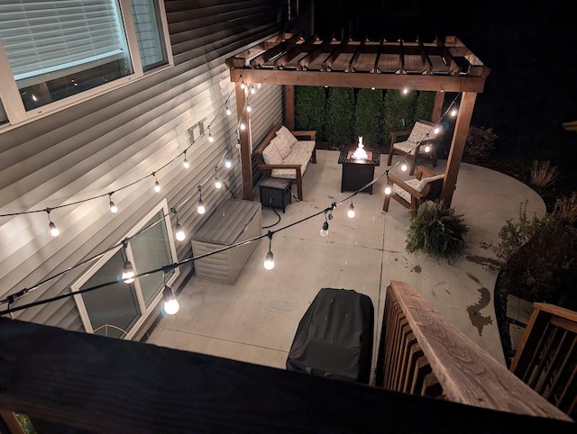 patio at night with a fire pit