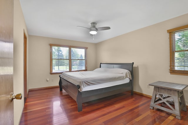 53201 Maranatha Ln, Wixom, MI 48393 - bedroom with wood-type flooring, baseboards, and a ceiling fan
