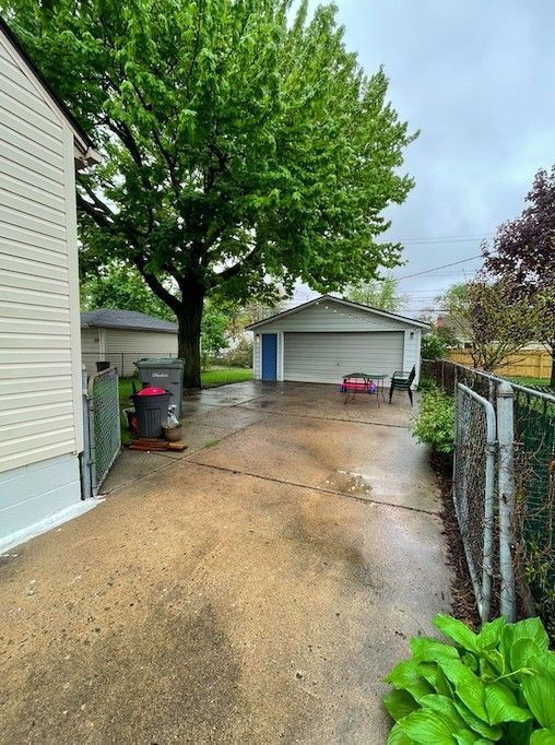 detached garage with fence