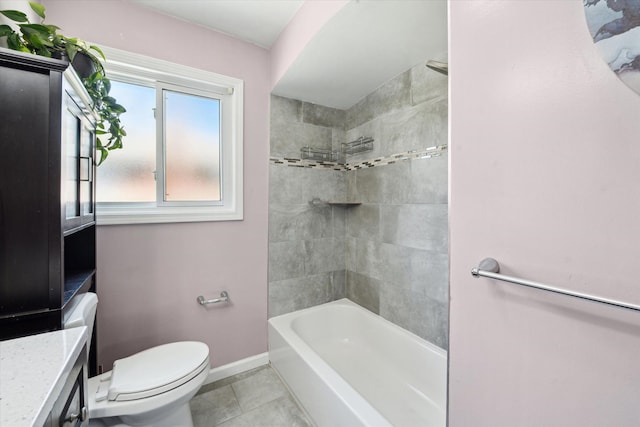 bathroom with baseboards, toilet, vanity, tile patterned flooring, and shower / tub combination