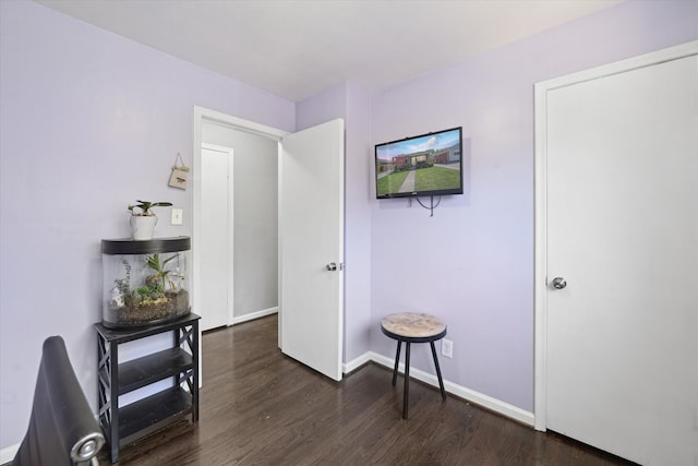 sitting room featuring wood finished floors and baseboards