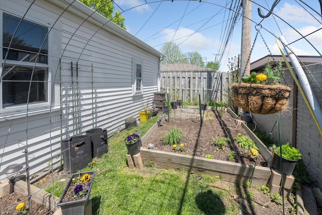 view of yard featuring a garden and fence