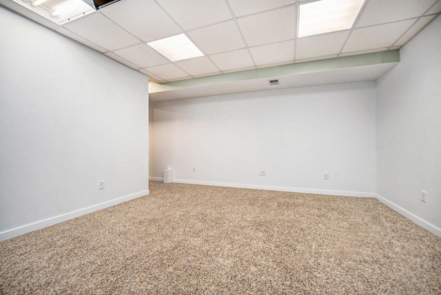 finished basement with carpet, baseboards, and visible vents