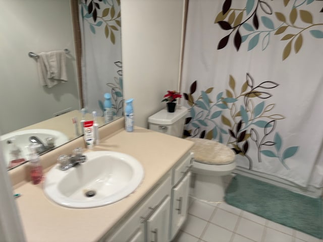 2725 Ormond Rd, White Lake, MI 48383 - bathroom with tile patterned flooring, toilet, vanity, and curtained shower