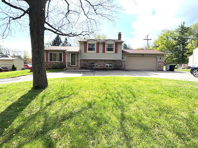 2725 Ormond Rd, White Lake, MI 48383 - tri-level home with a chimney, asphalt driveway, a garage, a front lawn, and brick siding